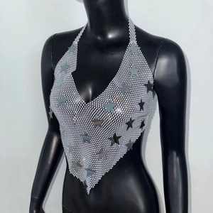 Detailed view of silver star sequins on metallic mesh halter neck crop top for women