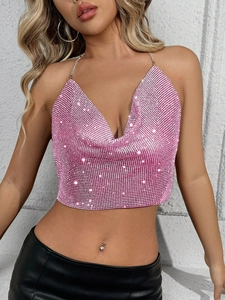 Detailed view of pink rhinestone halter top with deep V-neck and metal chains