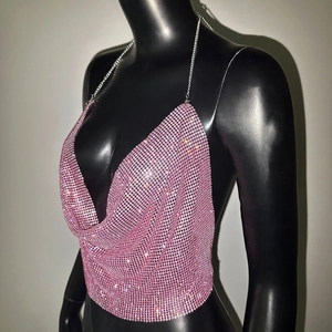 Close-up of pink rhinestone mesh camisole featuring V-neck and metal chain straps