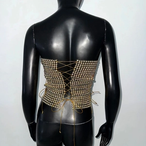 Detailed back view of sexy rhinestone bustier top with adjustable gold lace-up ties