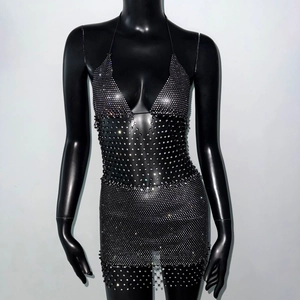Detailed view of sexy black fishnet two-piece set with shiny rhinestones for festivals