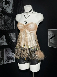 Detailed view of champagne gold mesh top with heart neckline and round sequin tassels