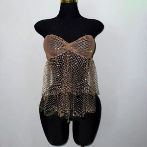 Macro view of metallic mesh top featuring shimmering rhinestones and sequin tassels