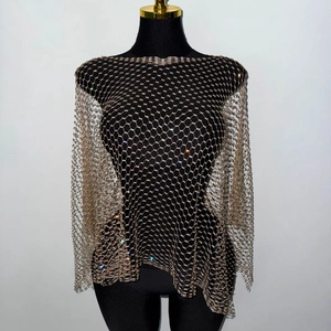 Detail of champagne gold mesh top with sparkling rhinestones on a mannequin stand