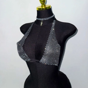 Sparkly silver sequin halter top for festivals, featuring a sexy backless mesh design