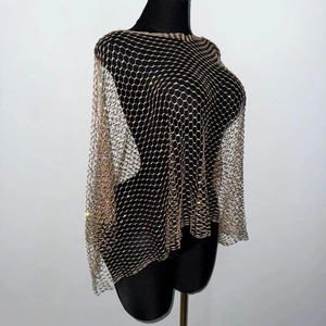 Detail of champagne gold mesh top featuring intricate hexagonal grid and sparkling rhinestones