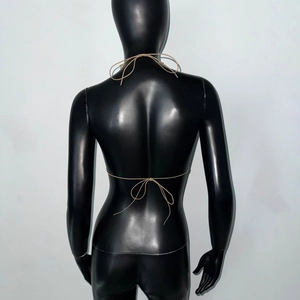 Back view of sexy khaki fishnet halter top with crisscross ties on a black mannequin