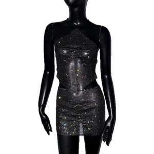 Black rhinestone fishnet two-piece set featuring a halter top and mini skirt on mannequin