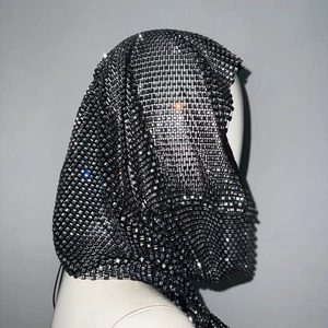 Detail shot of black mesh hood accessory with sparkling square crystals for party wear
