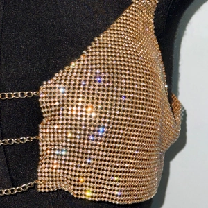 Close-up of golden mesh rhinestone top with shimmering crystals and adjustable chain