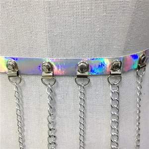 Close-up of holographic PU leather belt with hanging silver metal fringe chains