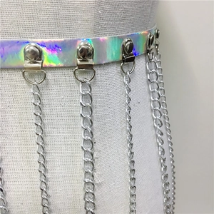 Detail of silver holographic PU leather waist belt featuring five metal fringe chain tassels
