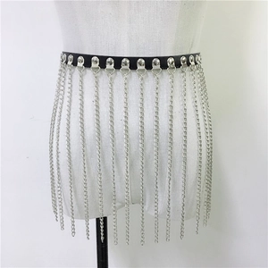 Detail of silver metal tassel chains and black PU leather on a punk style waist belt