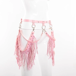 Detail of pink punk leather fringe belt with star studs and silver rings on white mannequin