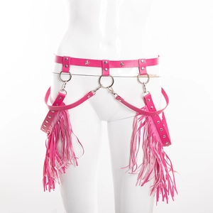 Detail of hot pink punk leather waist belt with silver star studs and long fringes