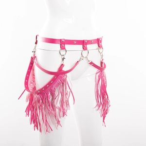 Detail of hot pink punk leather belt with star rivets, metal rings and long tassels