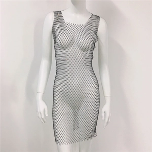 Close-up of mesh hollow-out dress featuring shiny rhinestones on black netting fabric