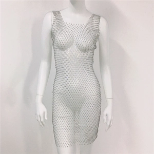 Close-up of sparkling rhinestones and hollow mesh fabric on a sexy silver party dress