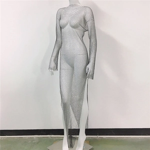 Detailed view of black fishnet long sleeve dress with shimmering silver rhinestones