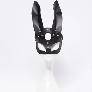 Detailed close-up of bunny girl mask showing black leather texture and silver metal rivets