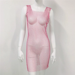 Detail of rose red rhinestone mesh dress showing intricate hollow out fishnet patterns