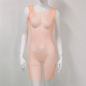 Close-up of orange mesh dress featuring intricate rhinestones and sheer nylon fabric