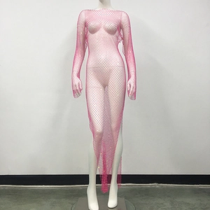 Close-up of pink rhinestone fishnet dress with sparkling mesh fabric and asymmetrical hem