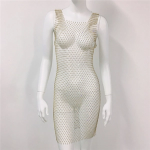 Close-up of gold mesh fishnet dress with sparkling rhinestones on sleeveless design