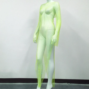 Macro detail of sexy lime green fishnet dress with sparkling rhinestones and side slit