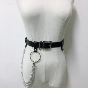 Detail of punk style black leather waist belt featuring silver metal rings and triple chains