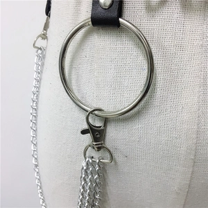 Detail of punk leather waist chain with large silver metal O-ring and lobster clasps