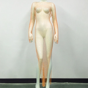 Detail of orange fishnet dress featuring sparkling rhinestones and a high side slit