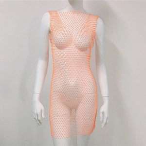Close-up of orange rhinestone fishnet dress featuring sparkling AB crystals on mesh fabric