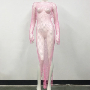 Detail of pink fishnet dress featuring sparkling rhinestones and asymmetrical hemline