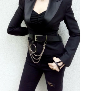 Punk style multi-layer chain belt with silver rings and faux leather on black suit