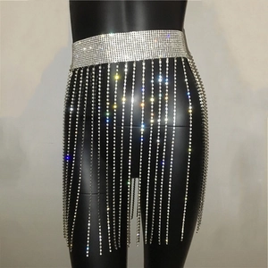 Close-up of sparkling rhinestone tassel body chain belt with long fringe on a mannequin