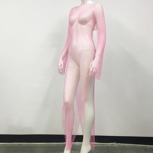Close-up of pink rhinestones on mesh sheer dress with high side slit and long sleeves