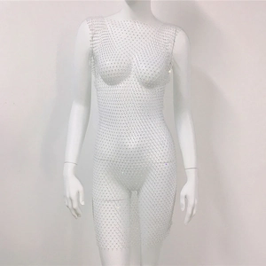 Detailed view of silver mesh dress with high-density shimmering rhinestones