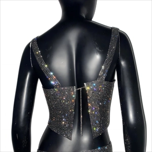 Detail view of the silver rhinestone crop top with adjustable metal chain and hook back closure