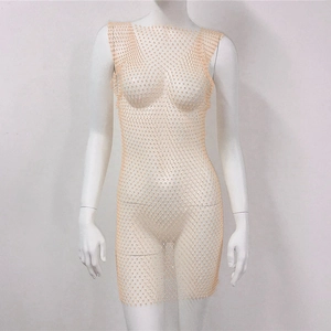Detail of nude mesh fishnet dress with sparkling rhinestones on sleeveless bodycon style