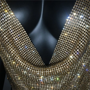 Close-up of golden mesh chain top with sparkling rhinestones for party wear