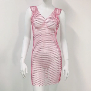 Detail of rose pink mesh mini dress featuring all-over rhinestones and deep V-neckline
