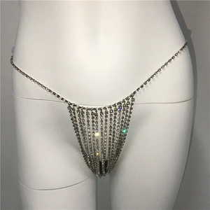 Detail view of shimmering silver rhinestone body chain with hanging triangle fringe on a mannequin