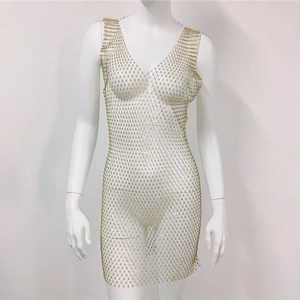 Detail of V-neck gold mesh dress featuring sparkling rhinestones and hollow-out fishnet texture