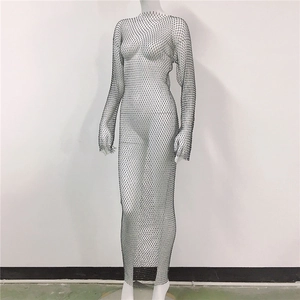 Close-up of black mesh fishnet dress with sparkling rhinestones and sheer side slit