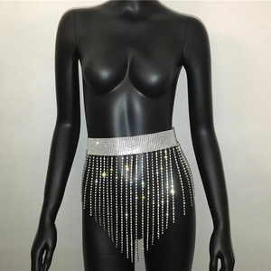 Detailed close-up of a silver rhinestone tassel body chain with shimmering fringe accents