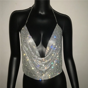Close-up of silver rhinestone mesh halter top with shimmering metal chain link details
