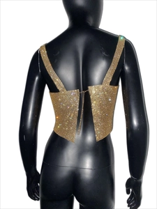 Detail view of sparkly gold rhinestone mesh crop top with elegant thin straps and metallic finish