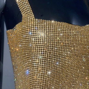 Detail of gold metal mesh top with sparkling rhinestones for sexy party style