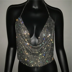 Detail of shimmering silver sequin halter top with crystal mesh and metal chains